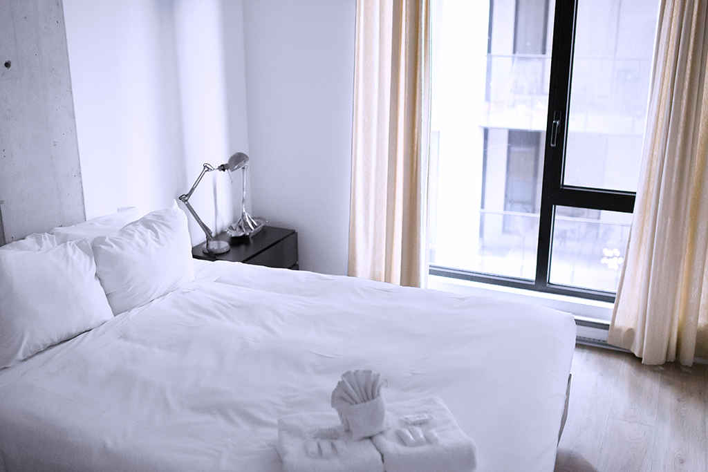 hotel room bed and window