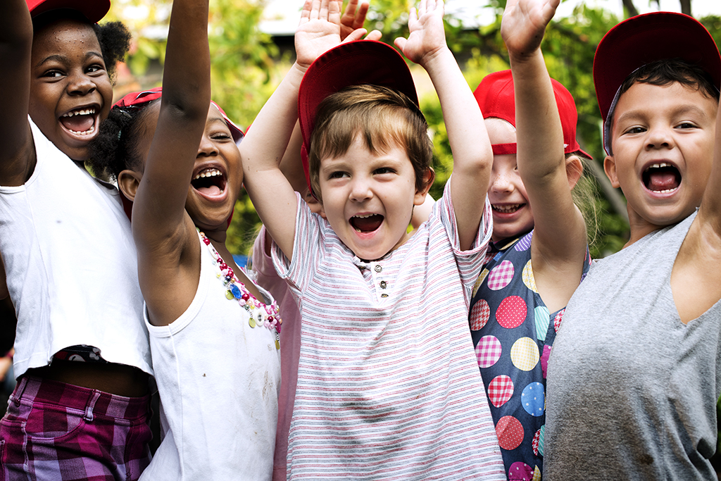 kids cheerful outdoors at a camp